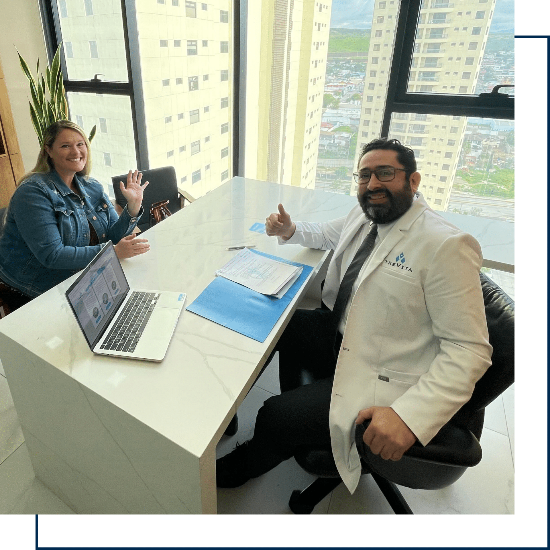 Dr. Mendiola with a happy client giving a thumbs up.